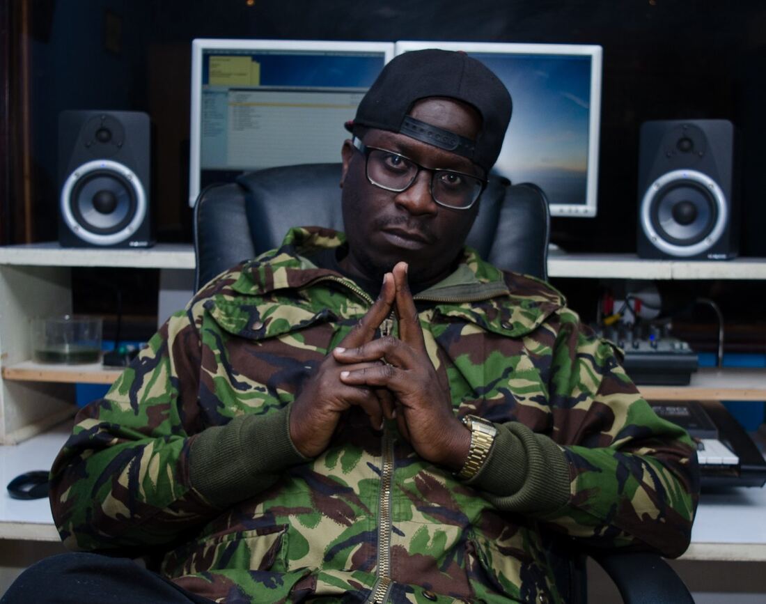 Solodified in the studio, camouflage jacket, hands clasped