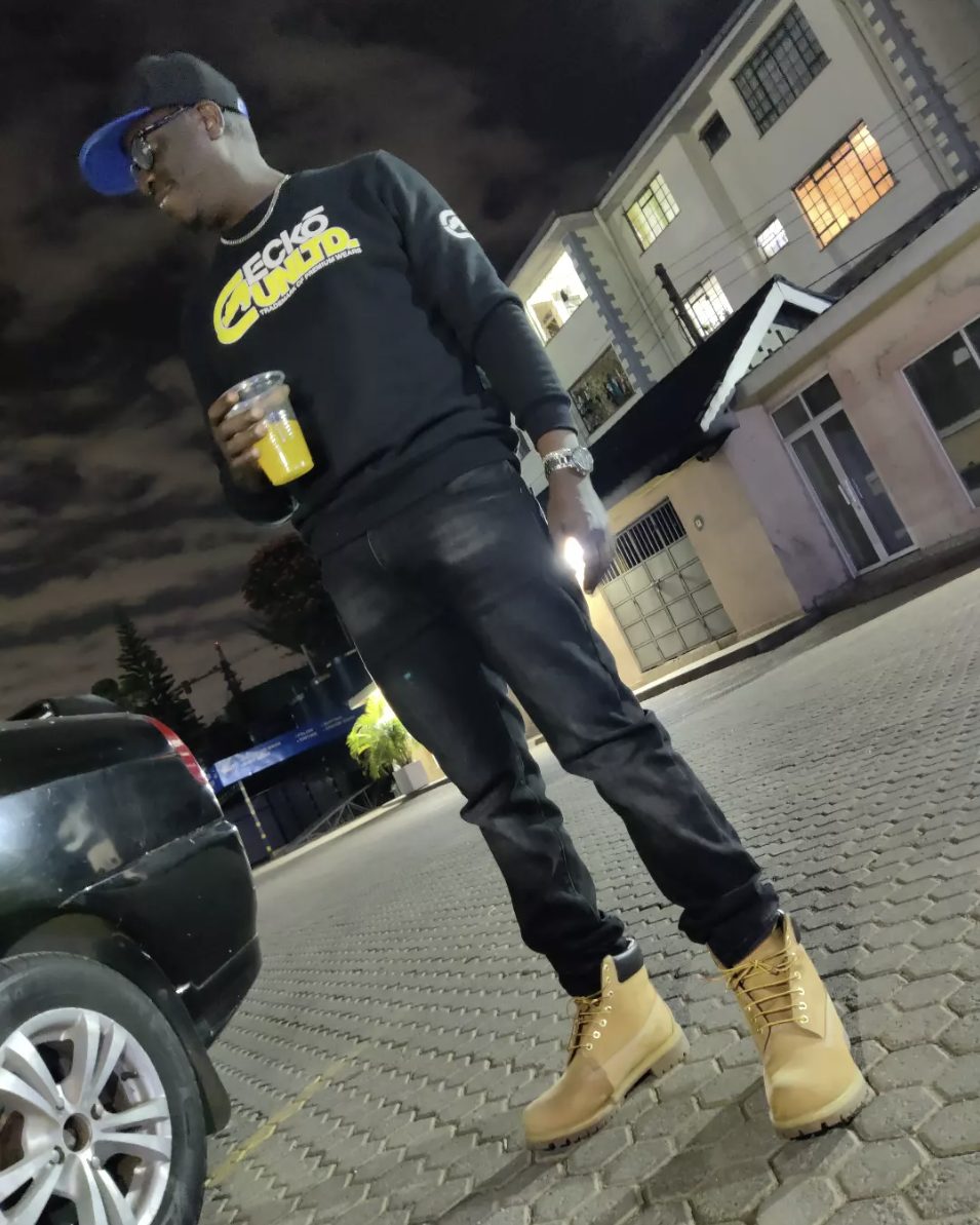 Solodified in dark streetwear at night in Nairobi